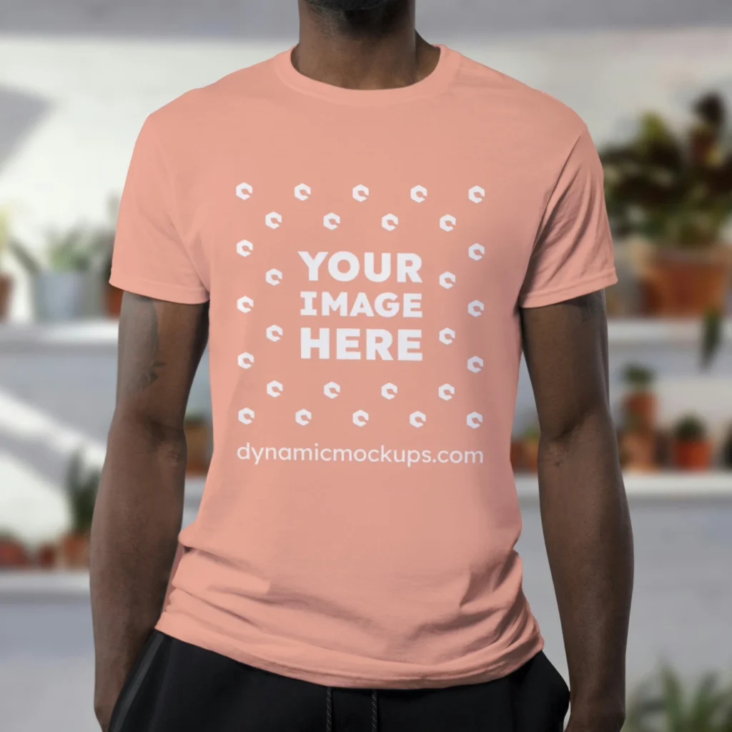 Man Wearing Peach T-shirt Mockup Front View Template