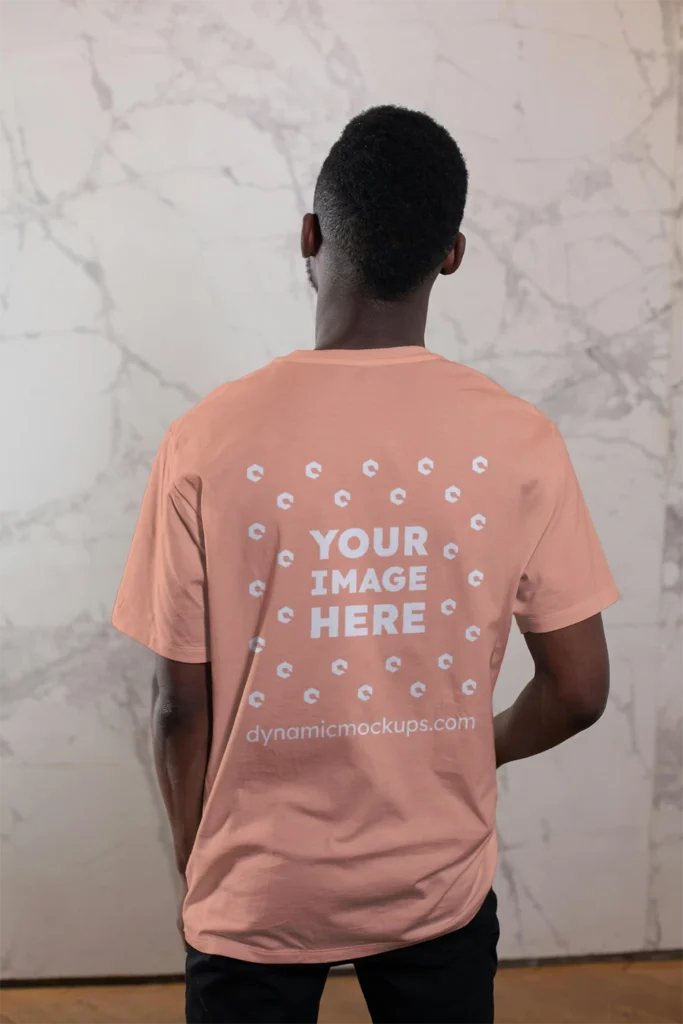 Man Wearing Peach T-shirt Mockup Back View Template