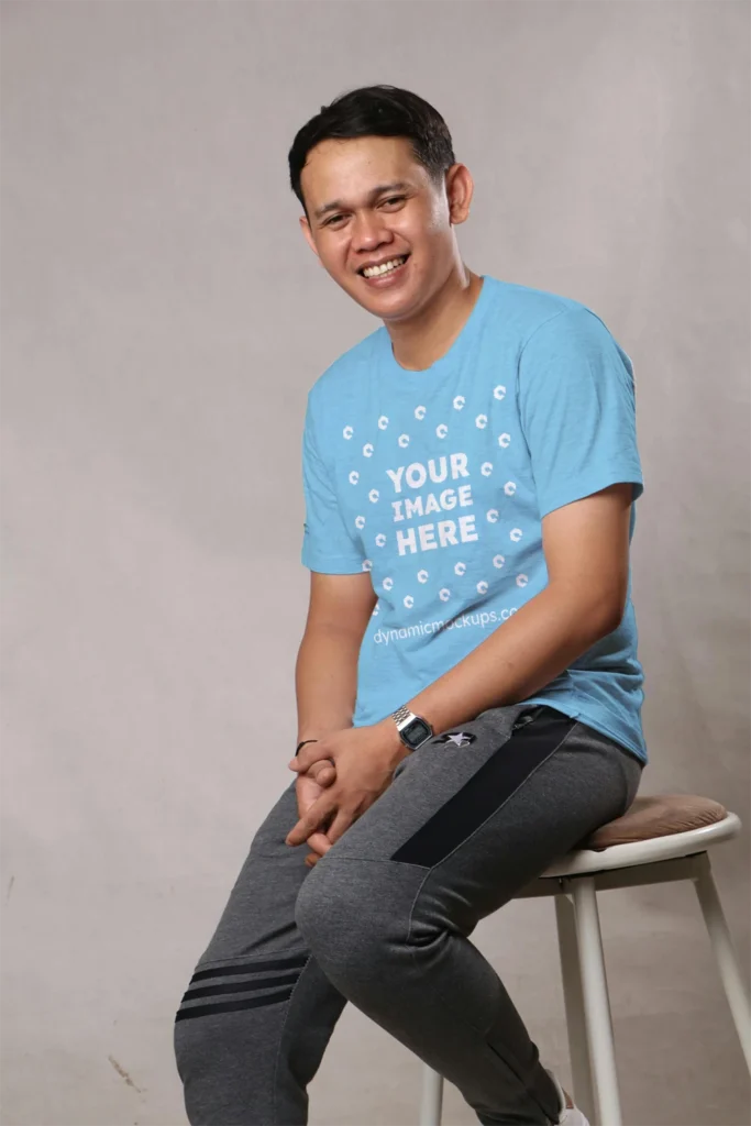 Man Wearing Sky Blue T-shirt Mockup Front View Template