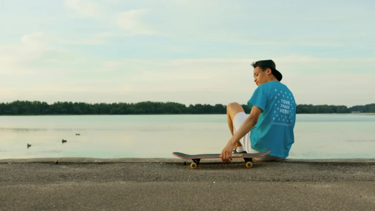 Man Wearing Teal T-shirt Mockup Front View Template