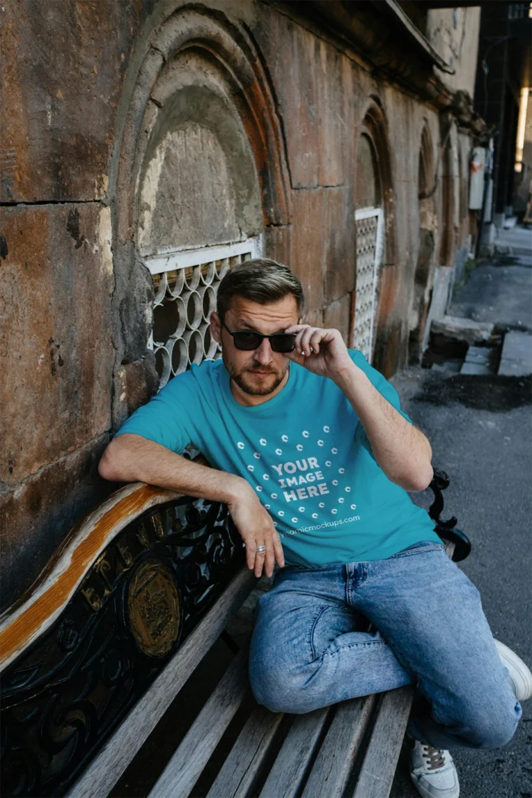 Man Wearing Teal T-shirt Mockup Front View Template