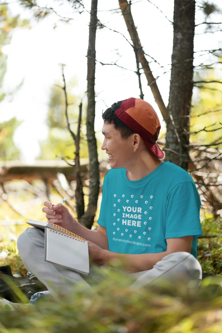 Man Wearing Teal T-shirt Mockup Front View Template