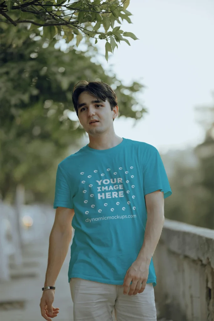 Man Wearing Teal T-shirt Mockup Front View Template