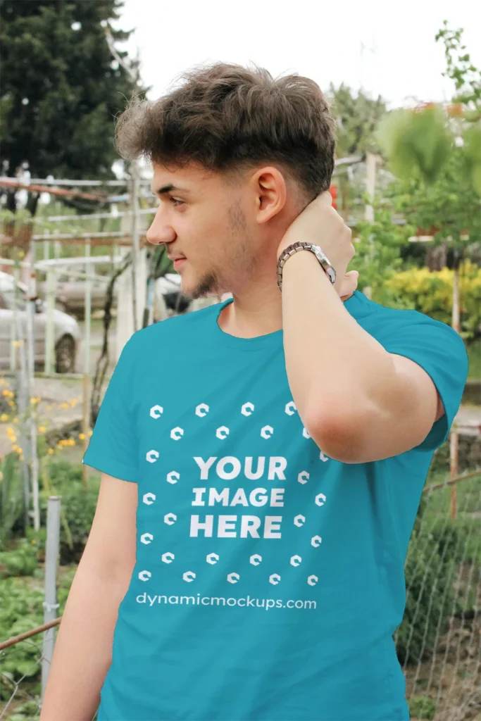 Man Wearing Teal T-shirt Mockup Front View Template