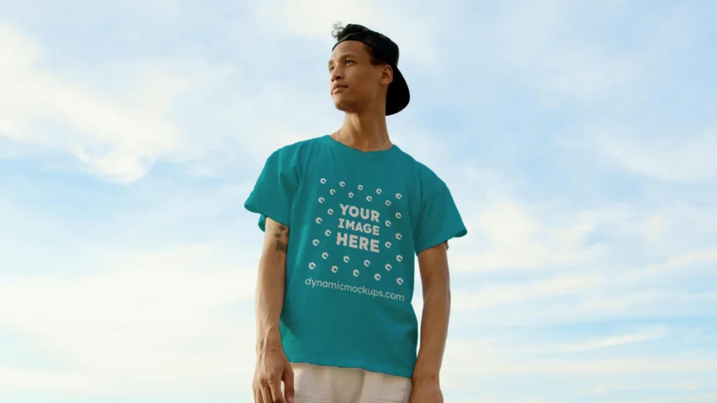 Man Wearing Teal T-shirt Mockup Front View Template