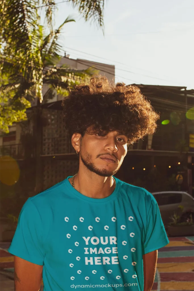 Man Wearing Teal T-shirt Mockup Front View Template