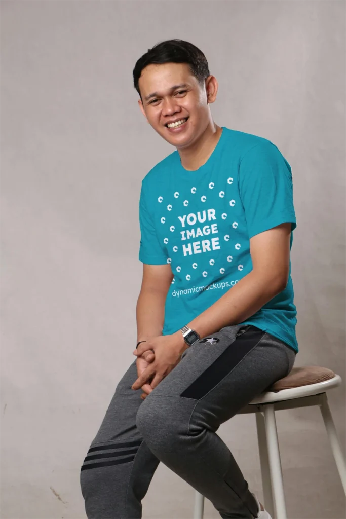 Man Wearing Teal T-shirt Mockup Front View Template