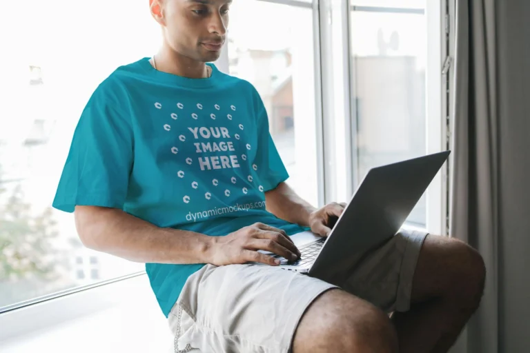 Man Wearing Teal T-shirt Mockup Front View Template