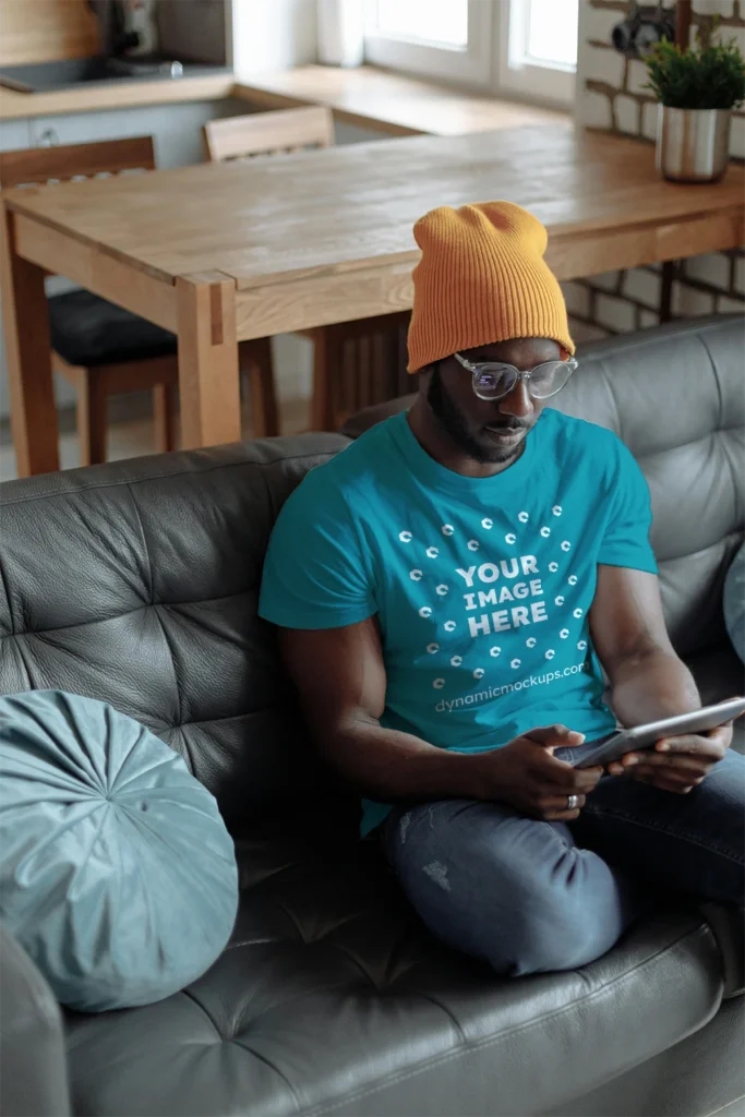 Man Wearing Teal T-shirt Mockup Front View Template