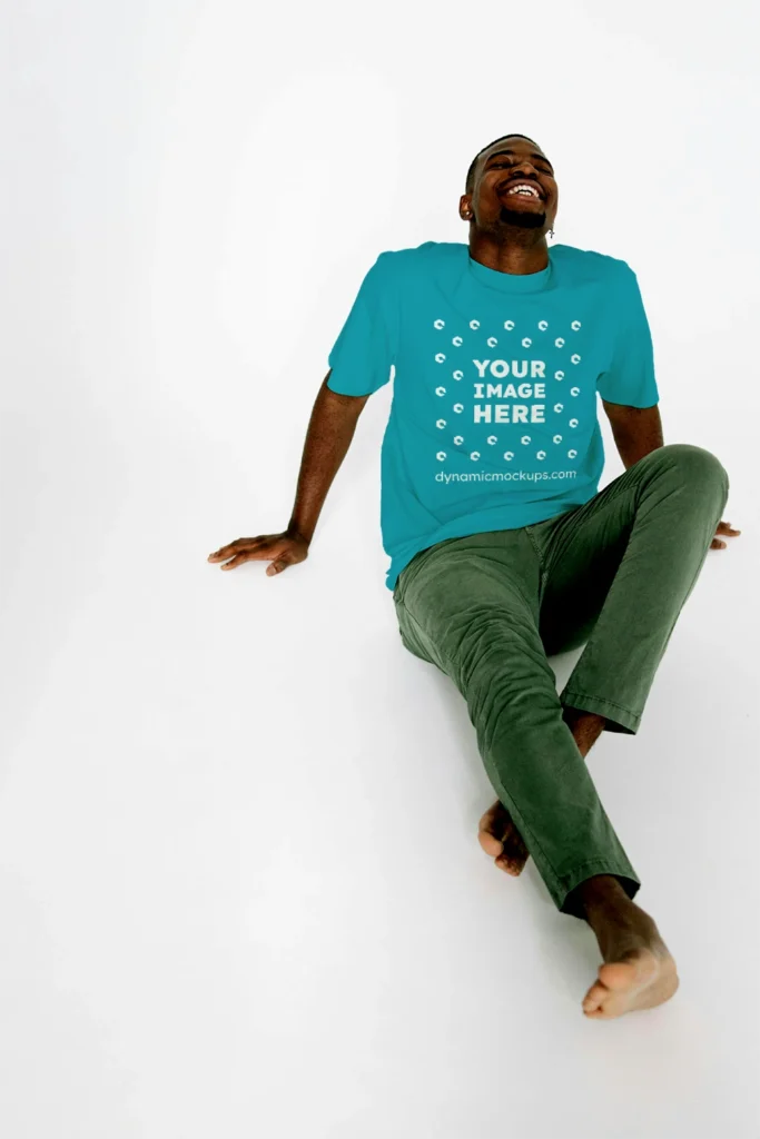 Man Wearing Teal T-shirt Mockup Front View Template