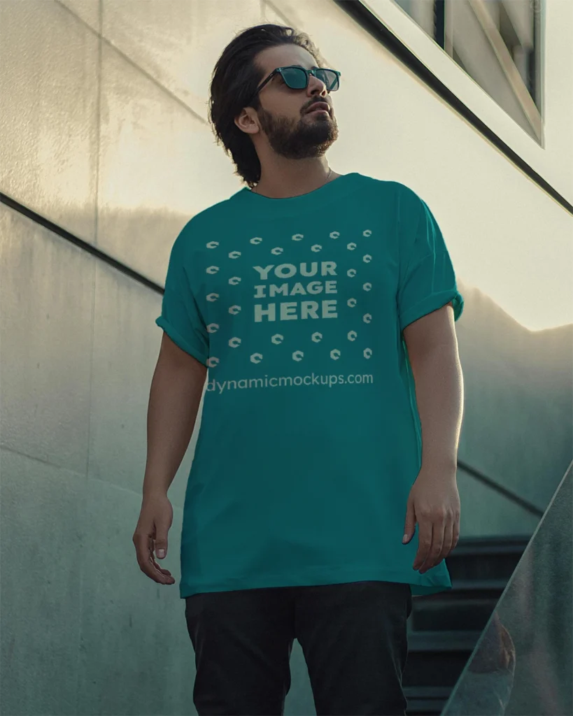 Man Wearing Teal T-shirt Mockup Front View Template