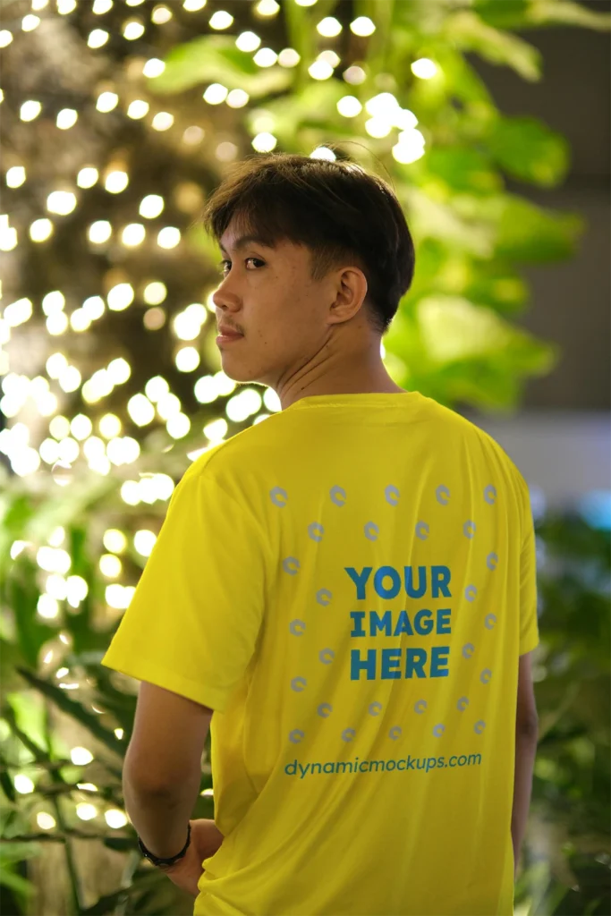 Man Wearing Yellow T-shirt Mockup Back View Template