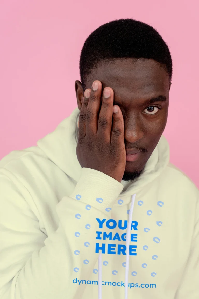Man Wearing Cream Hoodie Mockup Front View Template