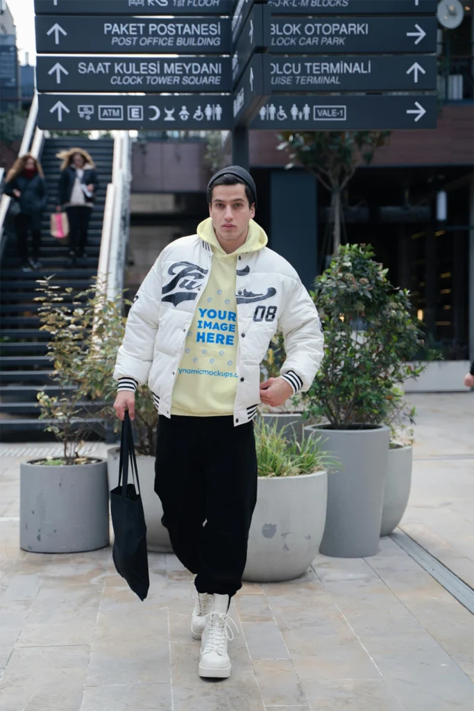Man Wearing Cream Hoodie Mockup Front View Template
