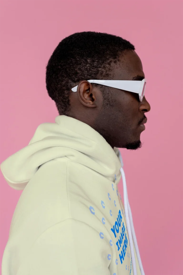 Man Wearing Cream Hoodie Mockup Side View Template