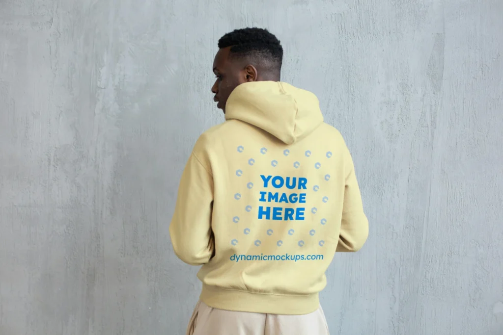Man Wearing Cream Hoodie Mockup Back View Template