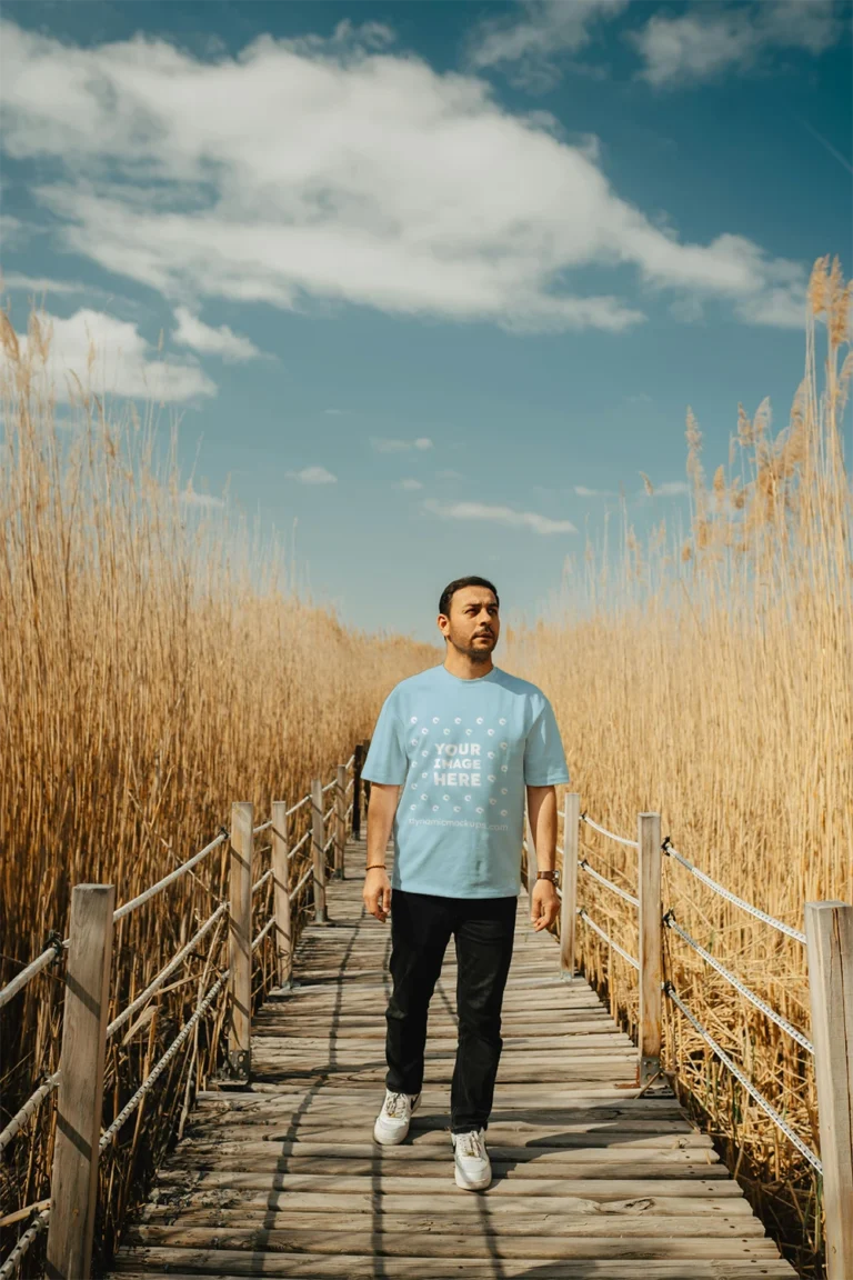 Man Wearing Light Blue T-shirt Mockup Front View Template