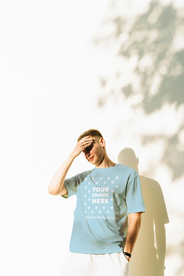 Man Wearing Light Blue T-shirt Mockup Front View Template