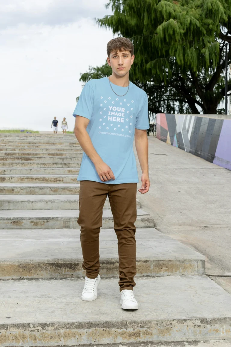 Man Wearing Light Blue T-shirt Mockup Front View Template