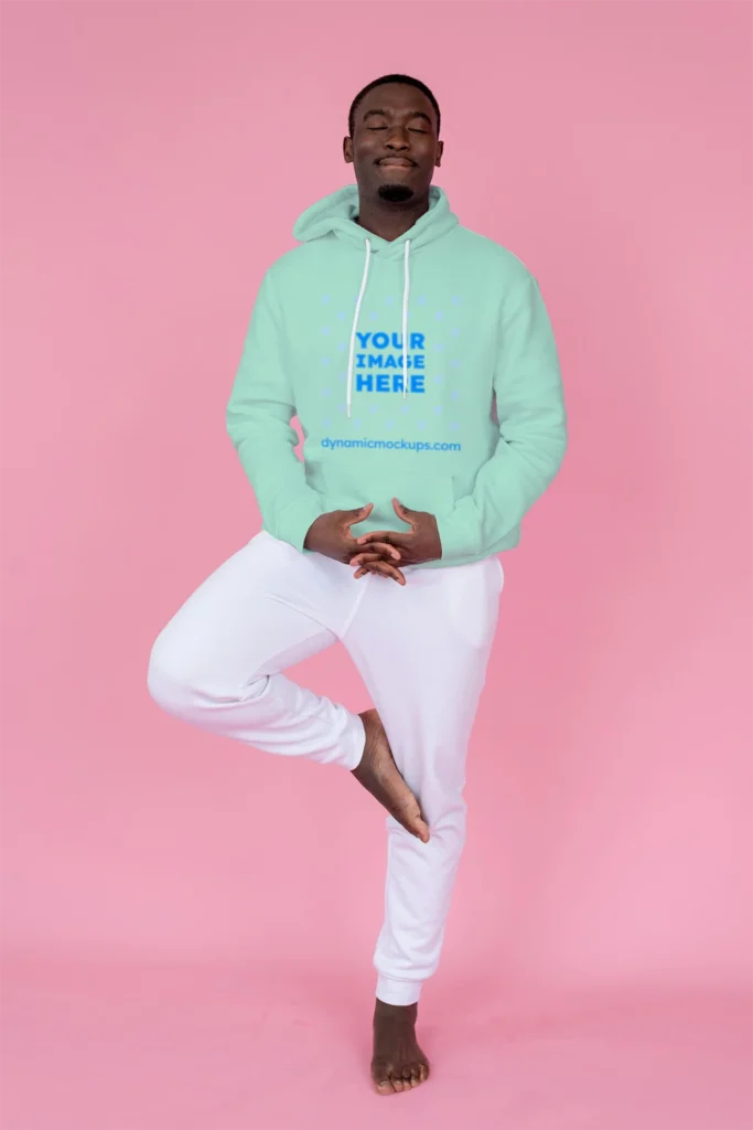 Man Wearing Mint Hoodie Mockup Front View Template