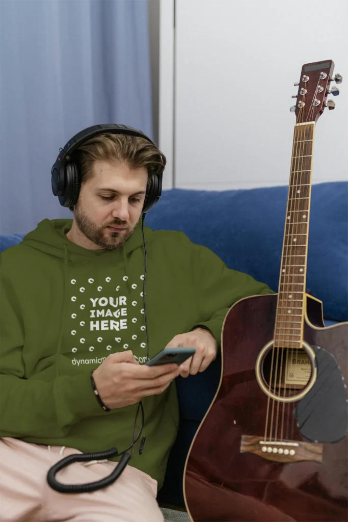 Man Wearing Olive Green Hoodie Mockup Front View Template