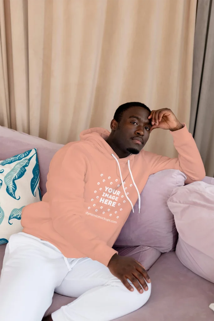 Man Wearing Peach Hoodie Mockup Front View Template
