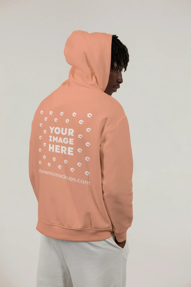 Man Wearing Peach Hoodie Mockup Back View Template