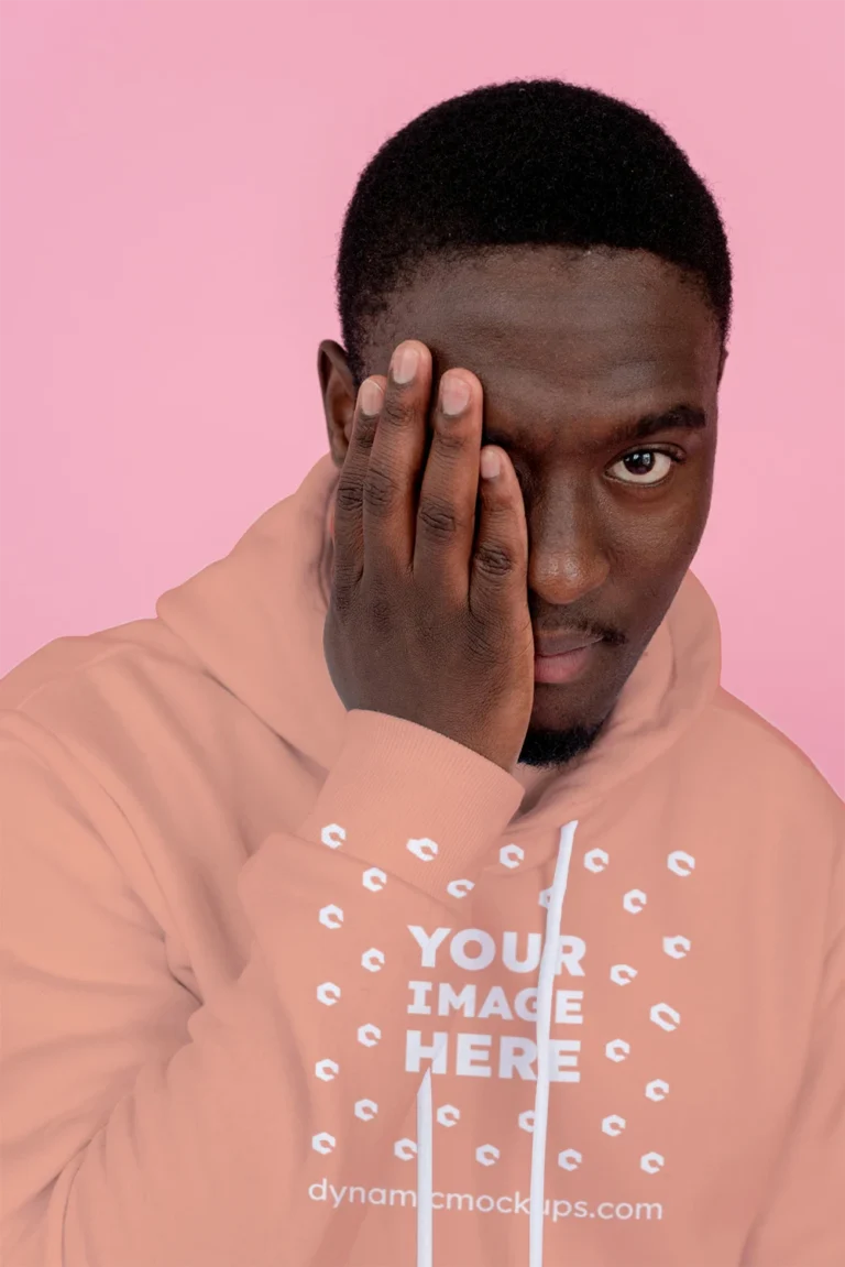 Man Wearing Peach Hoodie Mockup Front View Template