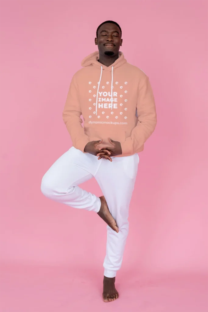 Man Wearing Peach Hoodie Mockup Front View Template