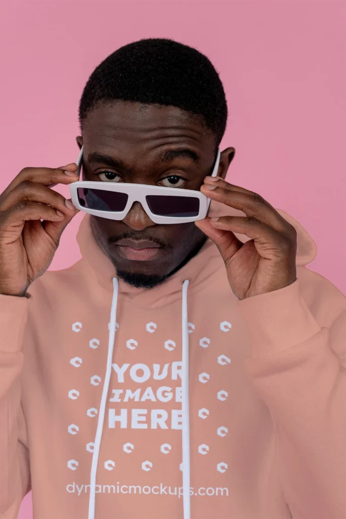 Man Wearing Peach Hoodie Mockup Front View Template