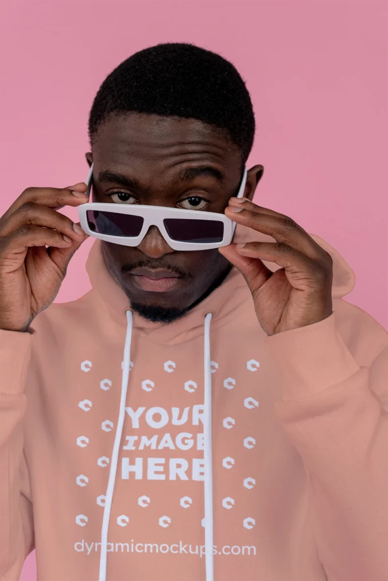 Man Wearing Peach Hoodie Mockup Front View Template