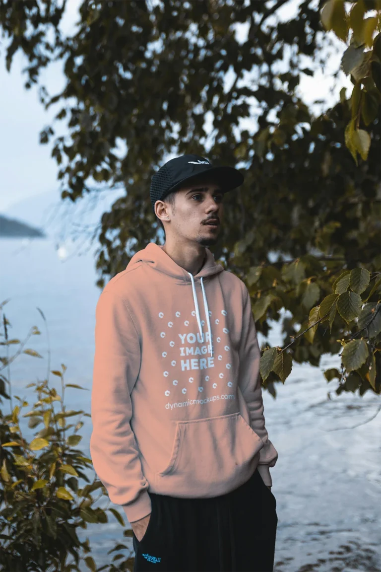 Man Wearing Peach Hoodie Mockup Front View Template