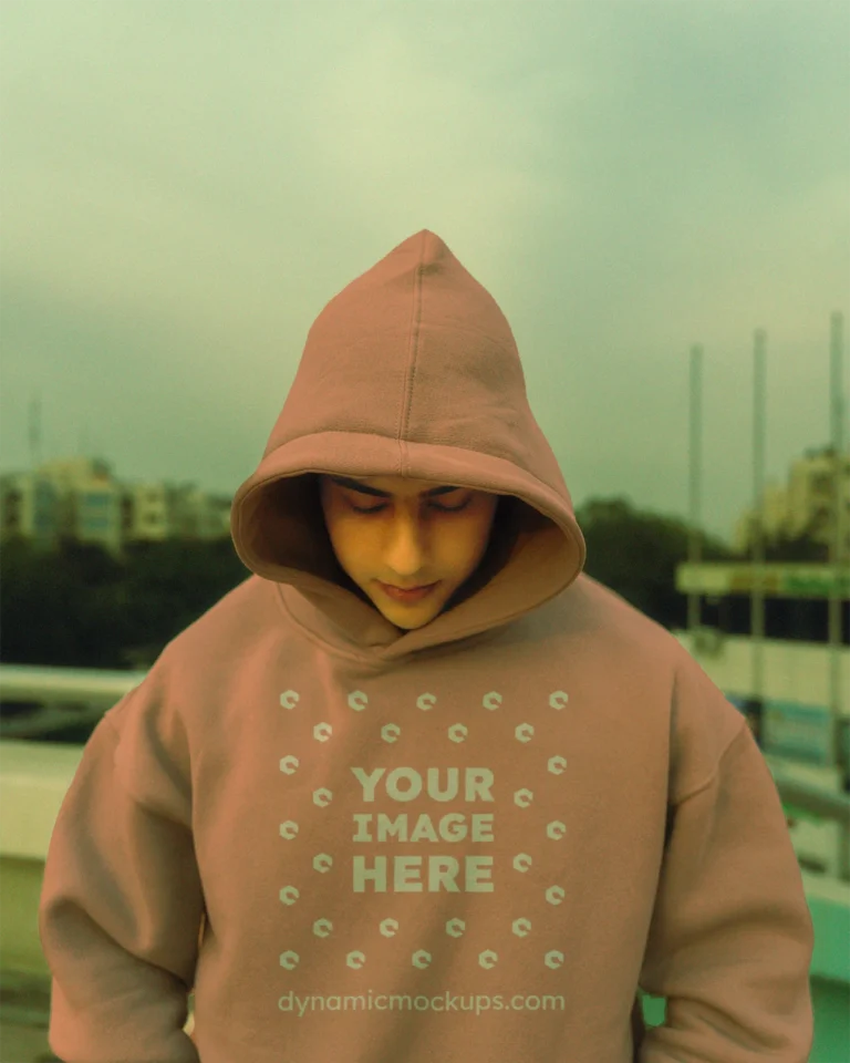 Man Wearing Peach Hoodie Mockup Front View Template