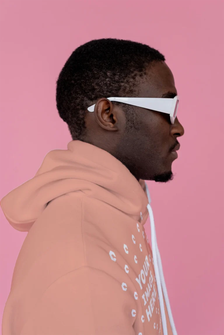 Man Wearing Peach Hoodie Mockup Side View Template