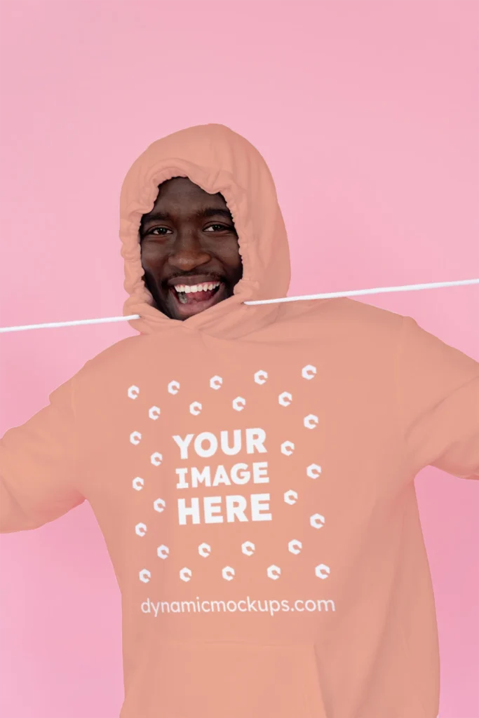 Man Wearing Peach Hoodie Mockup Front View Template
