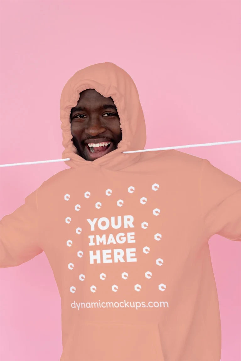 Man Wearing Peach Hoodie Mockup Front View Template