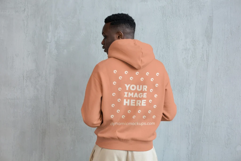 Man Wearing Peach Hoodie Mockup Back View Template