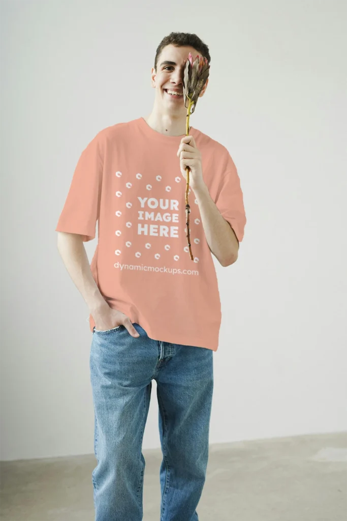 Man Wearing Peach T-shirt Mockup Front View Template