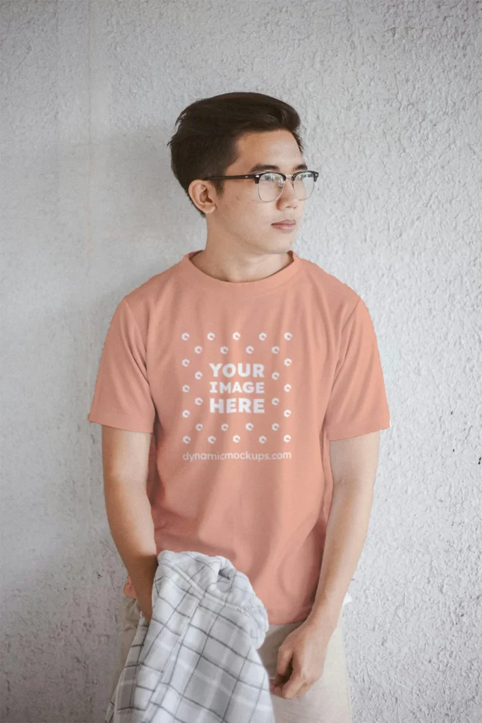 Man Wearing Peach T-shirt Mockup Front View Template