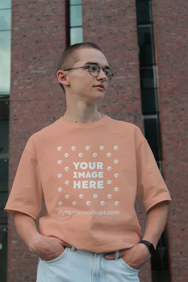 Man Wearing Peach T-shirt Mockup Front View Template