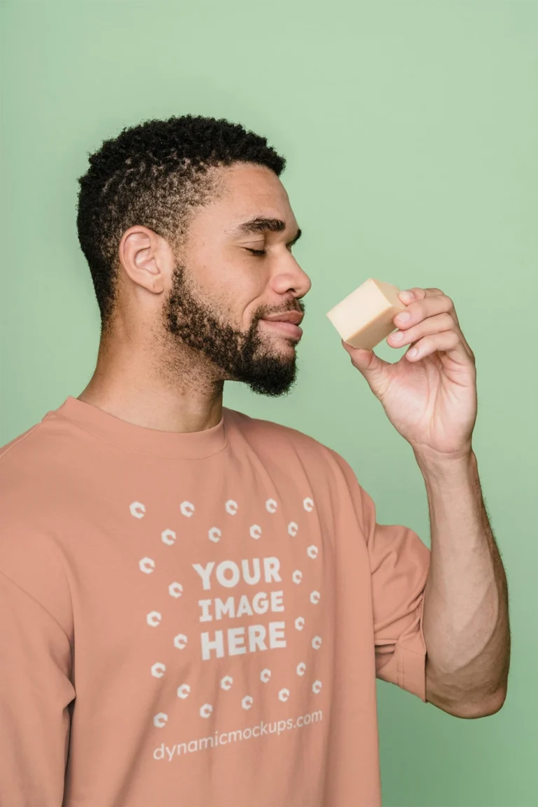 Man Wearing Peach T-shirt Mockup Front View Template