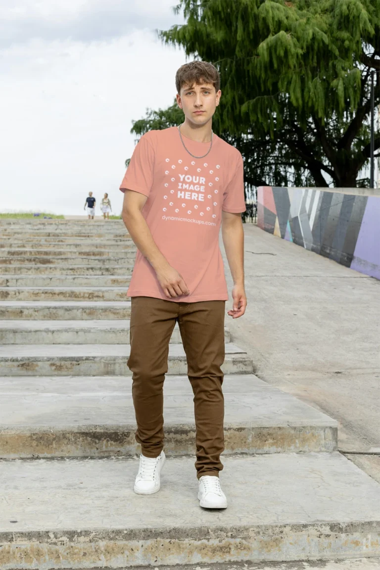 Man Wearing Peach T-shirt Mockup Front View Template