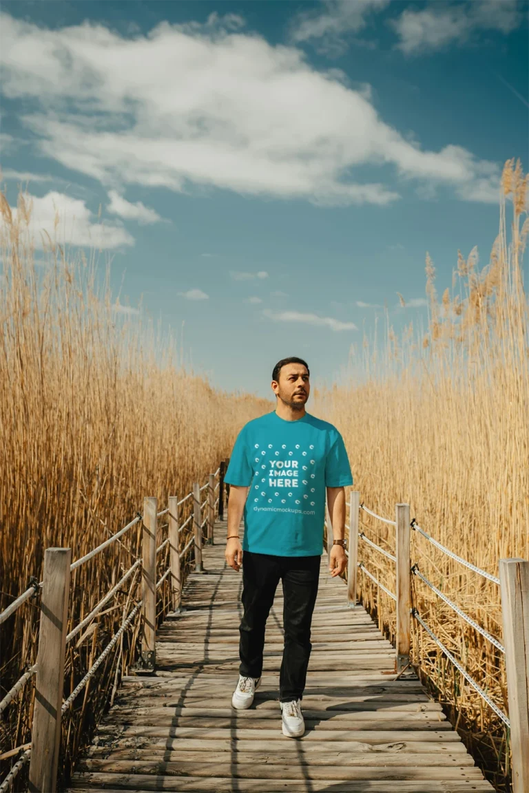 Man Wearing Teal T-shirt Mockup Front View Template