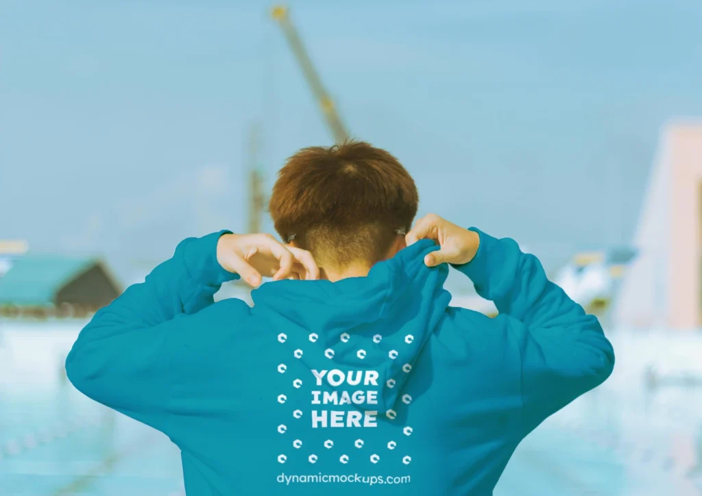 Man Wearing Teal Hoodie Mockup Back View Template