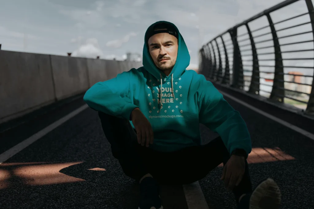 Man Wearing Teal Hoodie Mockup Front View Template