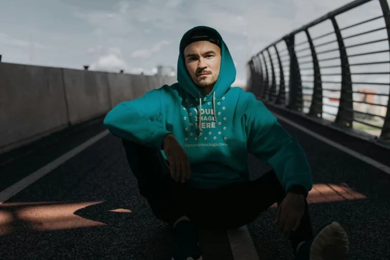 Man Wearing Teal Hoodie Mockup Front View Template