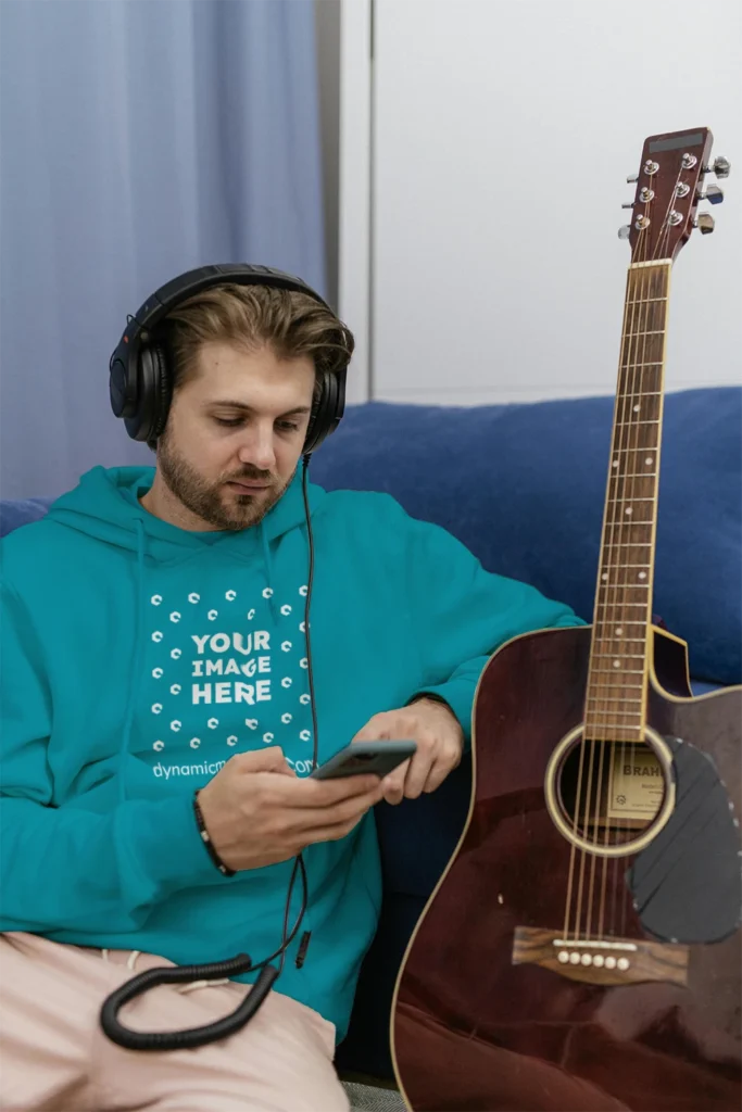 Man Wearing Teal Hoodie Mockup Front View Template