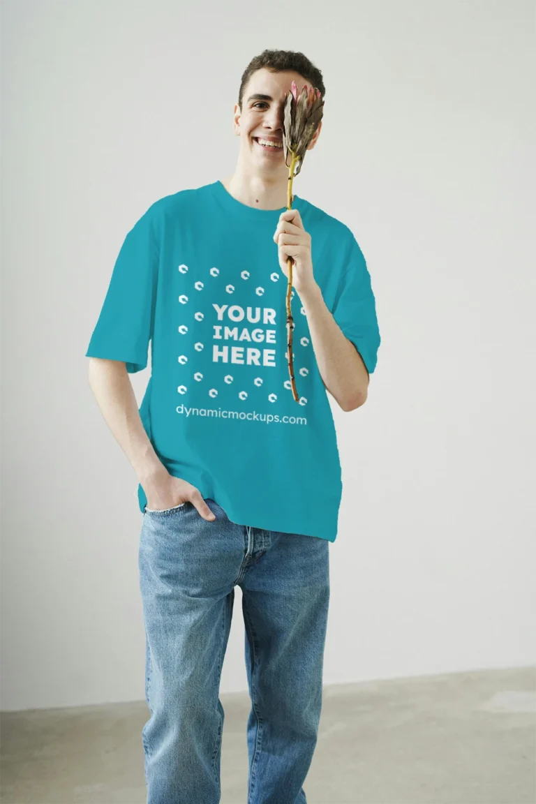 Man Wearing Teal T-shirt Mockup Front View Template