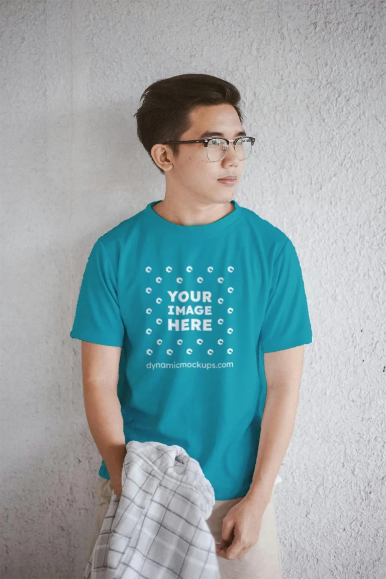 Man Wearing Teal T-shirt Mockup Front View Template