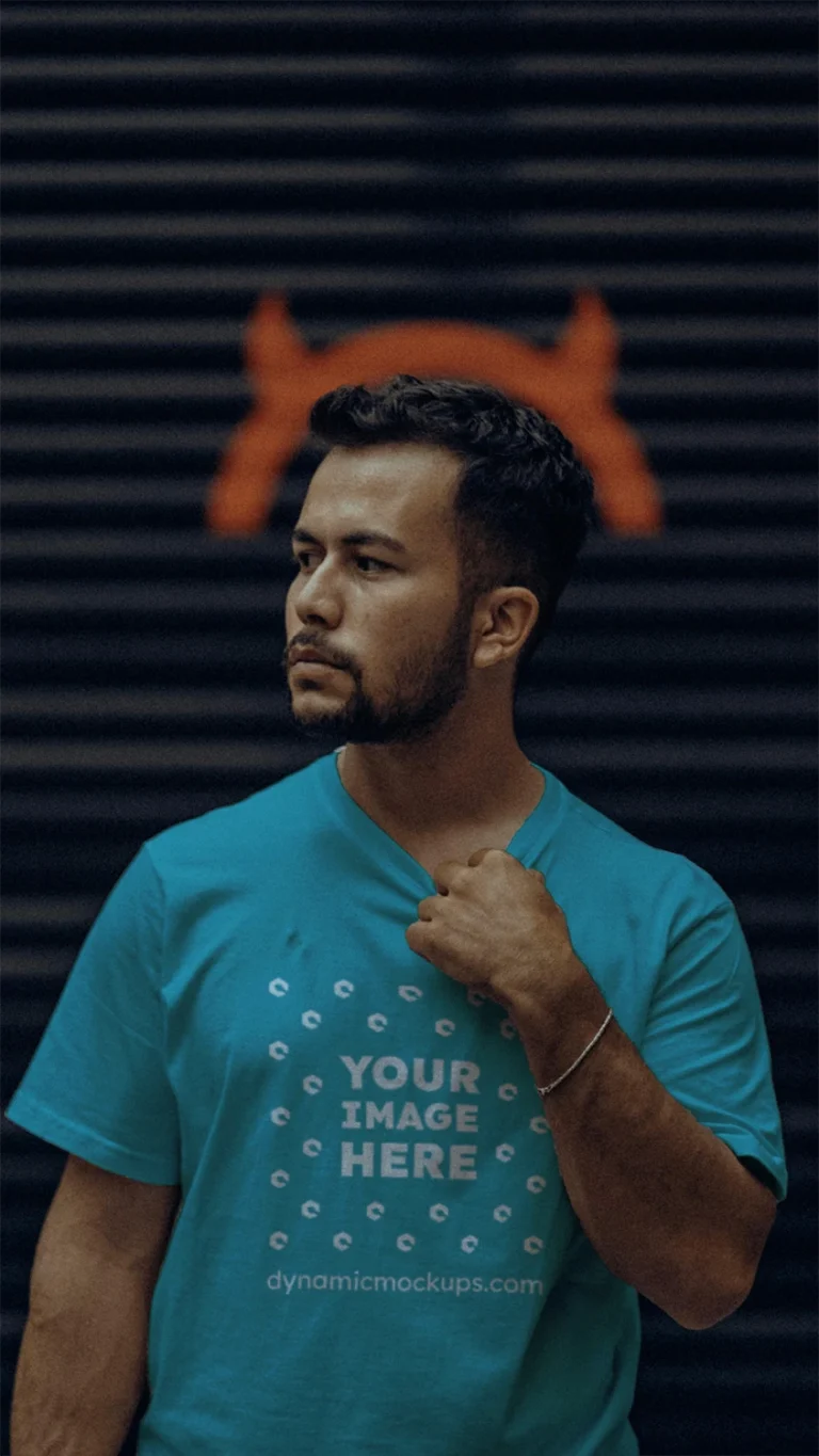 Man Wearing Teal T-shirt Mockup Front View Template